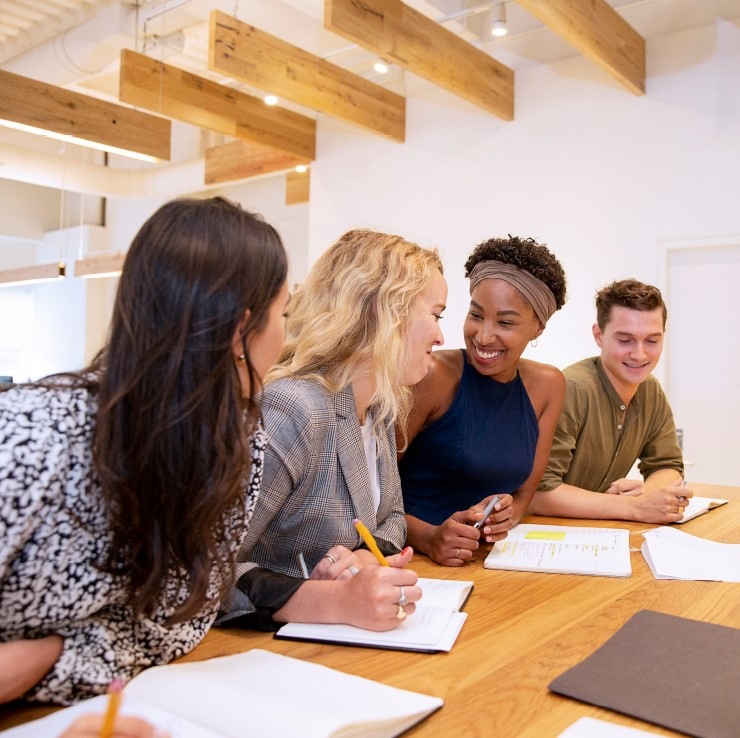 A group of employees at a conference table