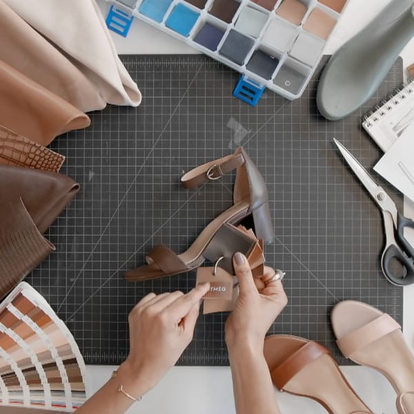 Shoe designers workspace including material swatches and color chips